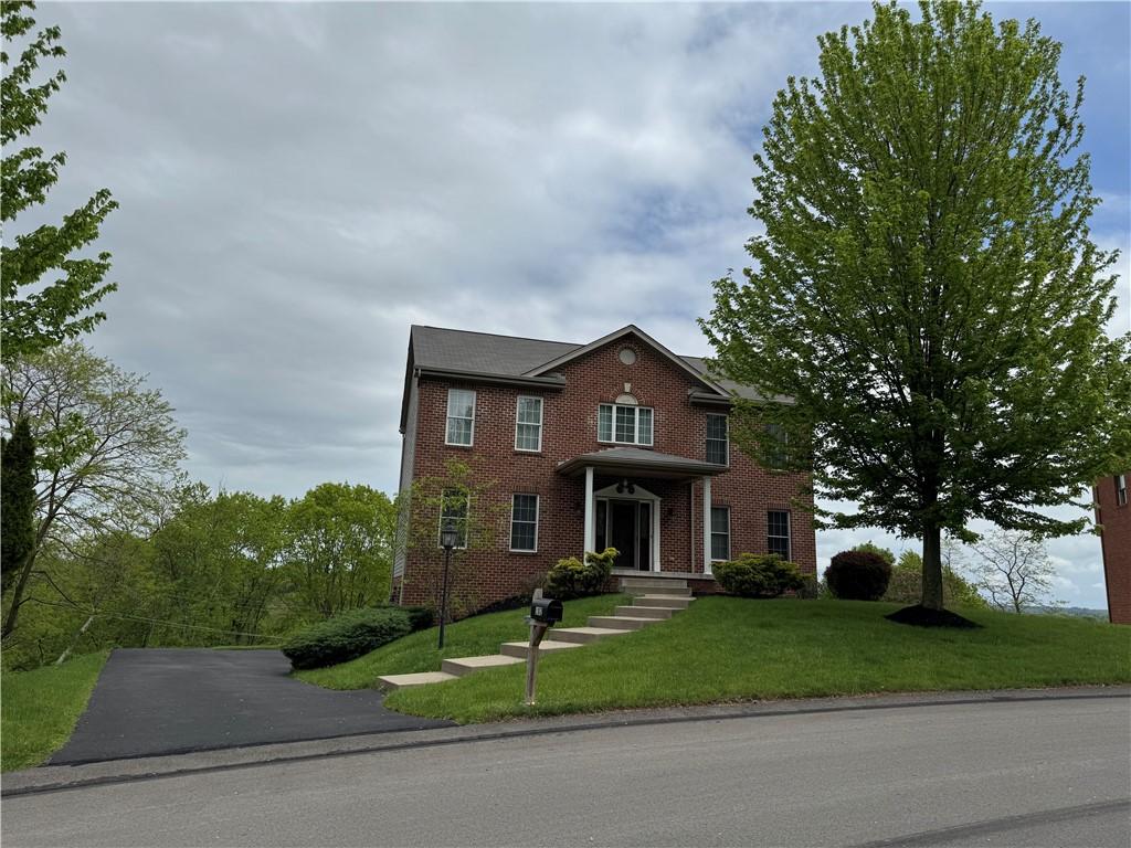 102 Sloan Ct, Ross Twp, PA 15237 - view of front of house featuring brick siding and a front lawn
