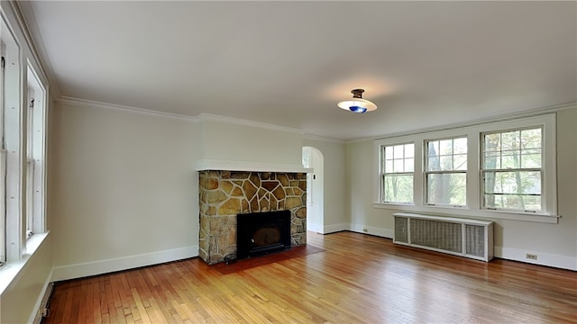 6927 Perrysville Ave, Ben Avon, PA 15202 - unfurnished living room featuring radiator, hardwood / wood-style flooring, crown molding, and baseboards