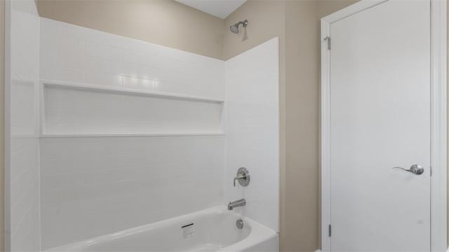 bathroom with bathing tub / shower combination