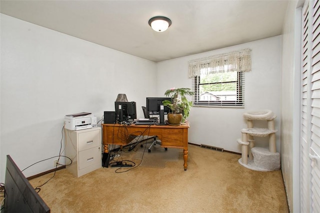 office space featuring light colored carpet and baseboards