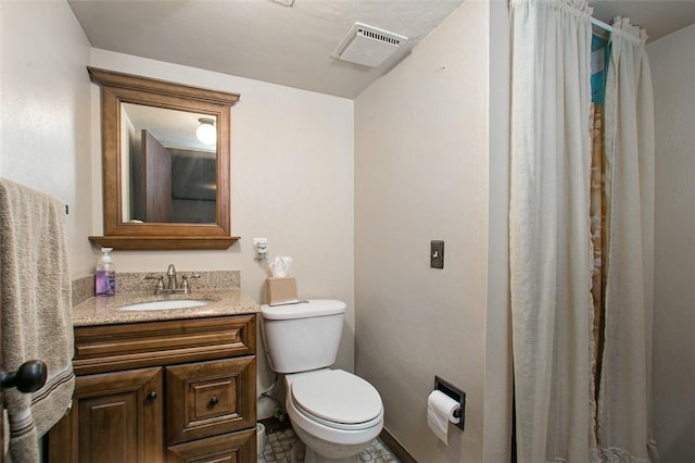 full bath featuring toilet and vanity
