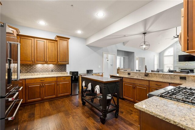 112 Shelton Place Dr, Connoquenessing Boro, PA 16033 - kitchen with a sink, dark wood-style floors, brown cabinets, tasteful backsplash, and recessed lighting