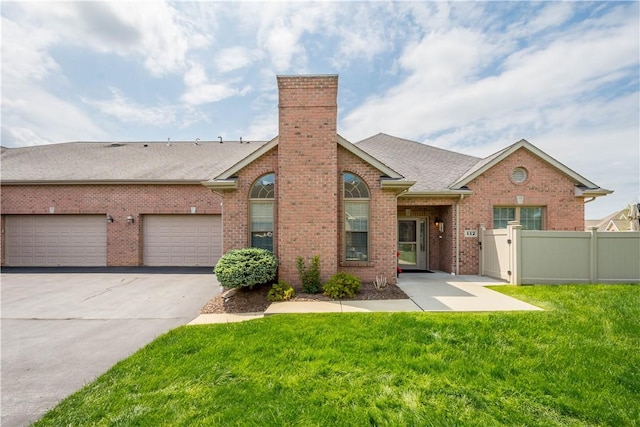 112 Shelton Place Dr, Connoquenessing Boro, PA 16033 - view of front of home with brick siding, a chimney, concrete driveway, and a shingled roof