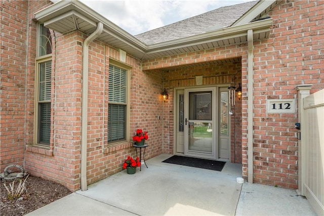 112 Shelton Place Dr, Connoquenessing Boro, PA 16033 - property entrance with a shingled roof and brick siding