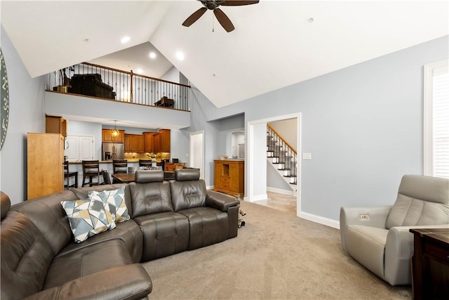112 Shelton Place Dr, Connoquenessing Boro, PA 16033 - living area featuring a ceiling fan, stairs, light colored carpet, baseboards, and high vaulted ceiling