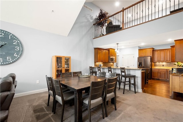 112 Shelton Place Dr, Connoquenessing Boro, PA 16033 - dining room featuring high vaulted ceiling, carpet floors, and baseboards