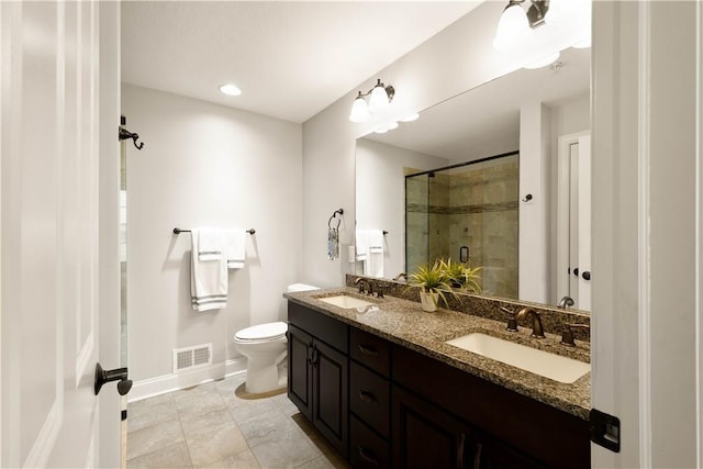 112 Shelton Place Dr, Connoquenessing Boro, PA 16033 - bathroom with a shower stall, baseboards, toilet, double vanity, and tile patterned floors