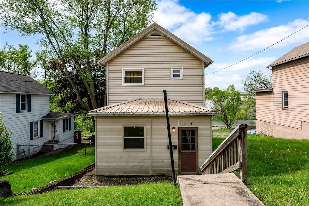 112 Bessemer Ave, Twp Of But Se, PA 16045 - back of property with a yard and metal roof
