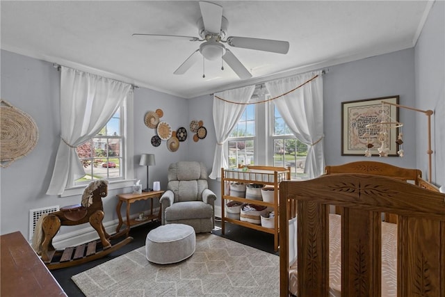 bedroom featuring ornamental molding and ceiling fan