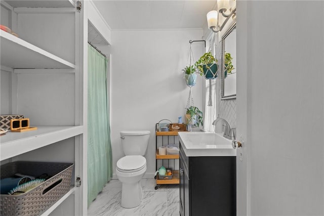 bathroom with toilet, marble finish flooring, and vanity