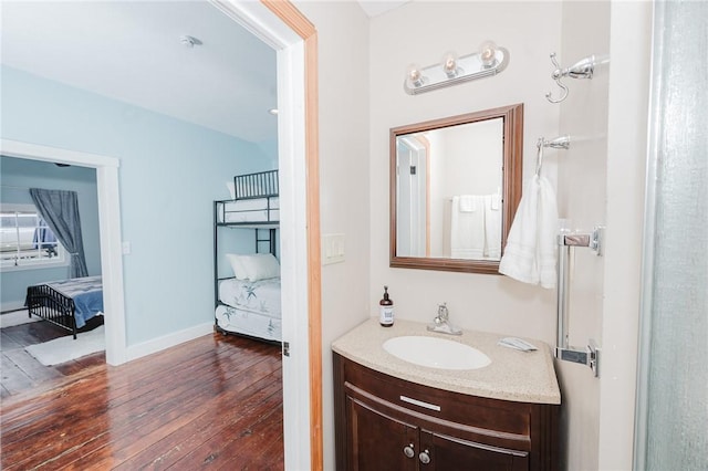 154 E Kittanning St, W/N Mahoning Twps, PA 16256 - ensuite bathroom with hardwood / wood-style flooring, vanity, and baseboards