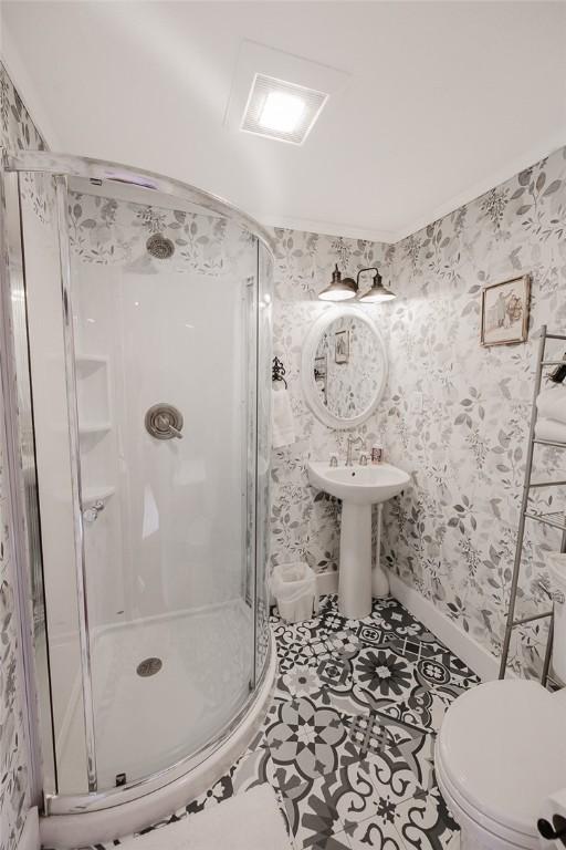 154 E Kittanning St, W/N Mahoning Twps, PA 16256 - bathroom featuring a stall shower, toilet, wallpapered walls, and tile patterned flooring