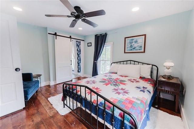 154 E Kittanning St, W/N Mahoning Twps, PA 16256 - bedroom featuring a barn door, hardwood / wood-style flooring, recessed lighting, baseboards, and ceiling fan
