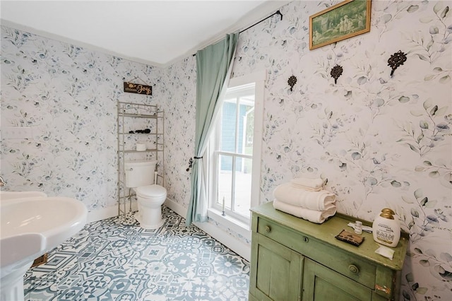 154 E Kittanning St, W/N Mahoning Twps, PA 16256 - bathroom with healthy amount of natural light, toilet, wallpapered walls, and baseboards