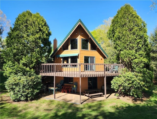 374 Latonka Dr, Jackson Twp Mer, PA 16137 - rear view of house with a wooden deck, a patio, a chimney, and a yard