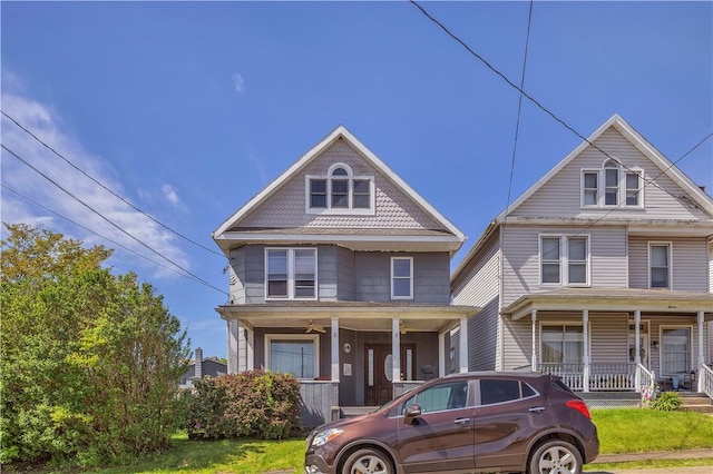 view of front of house featuring a porch and a front yard