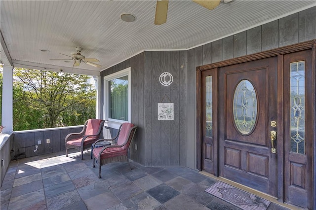 doorway to property featuring ceiling fan