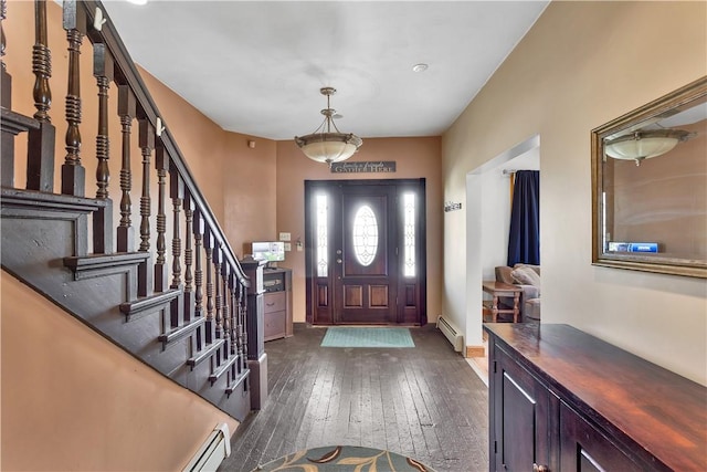 entryway featuring baseboard heating, dark wood-style flooring, stairs, and baseboards