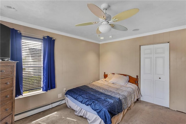 bedroom with baseboard heating, carpet flooring, crown molding, and ceiling fan