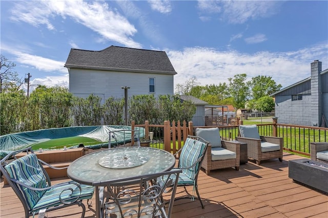 wooden deck featuring fence and outdoor dining area