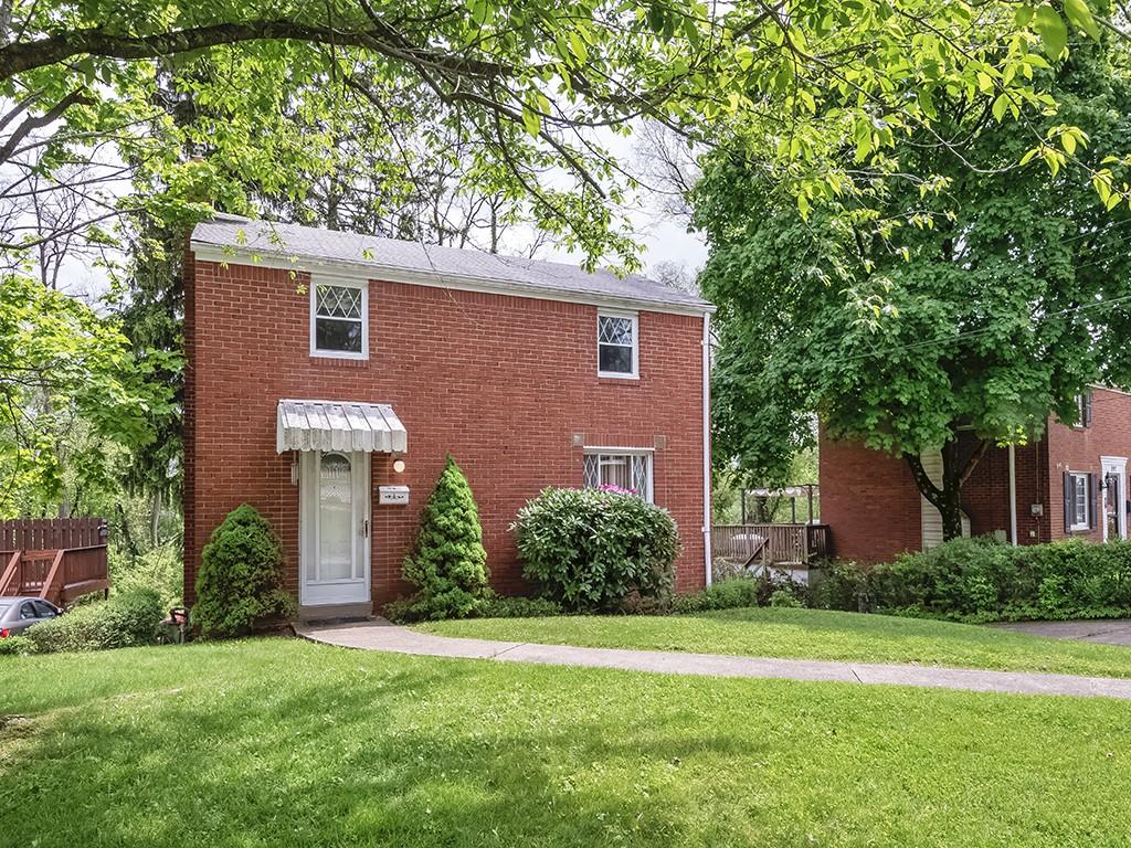 995 Elizabeth St, Wilkins Twp, PA 15221 - view of front of home with brick siding