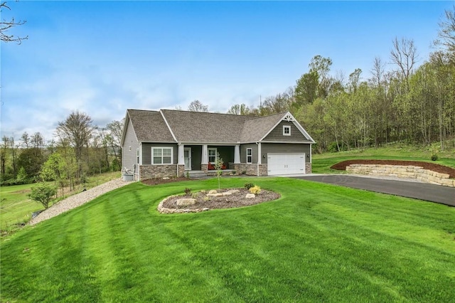 craftsman-style house featuring a front lawn, driveway, stone siding, a garage, and a shingled roof