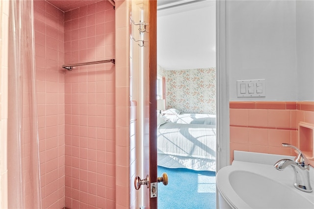 bathroom featuring ensuite bath, tiled shower, and vanity