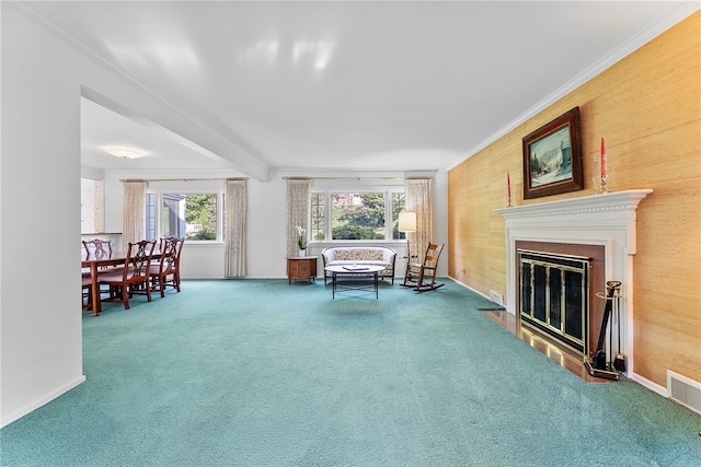 sitting room featuring carpet floors, ornamental molding, and a fireplace with flush hearth