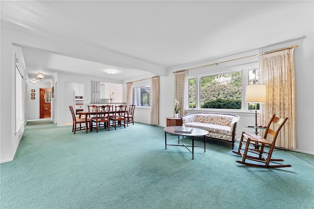 living room with carpet and ornamental molding