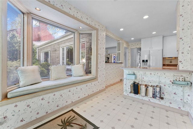 bathroom featuring wallpapered walls, tile patterned floors, baseboards, and recessed lighting