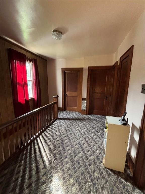 unfurnished bedroom featuring carpet