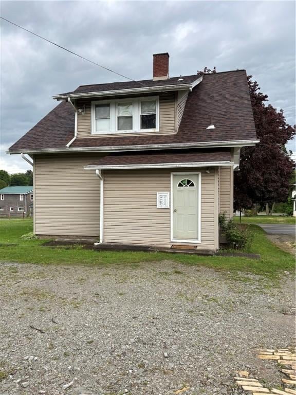 rear view of house with a chimney