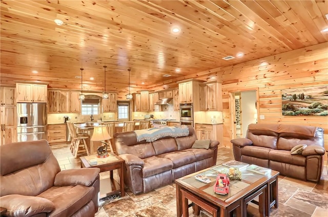 4038 State Route 156, Kiskiminetas Twp, PA 15618 - living area featuring wooden ceiling, recessed lighting, wooden walls, and stone tile floors