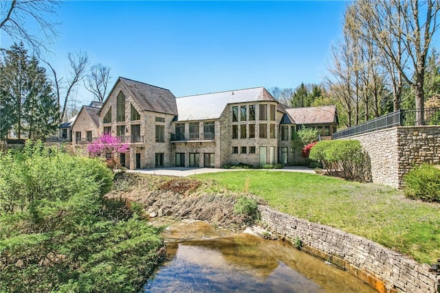 1700 Forker Blvd, Hermitage, PA 16148 - rear view of house with stone siding and a lawn