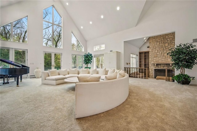 1700 Forker Blvd, Hermitage, PA 16148 - carpeted living room with high vaulted ceiling, healthy amount of natural light, recessed lighting, built in shelves, and a stone fireplace