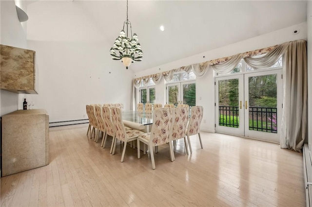 1700 Forker Blvd, Hermitage, PA 16148 - dining room featuring a baseboard heating unit, light wood-style floors, high vaulted ceiling, a chandelier, and french doors