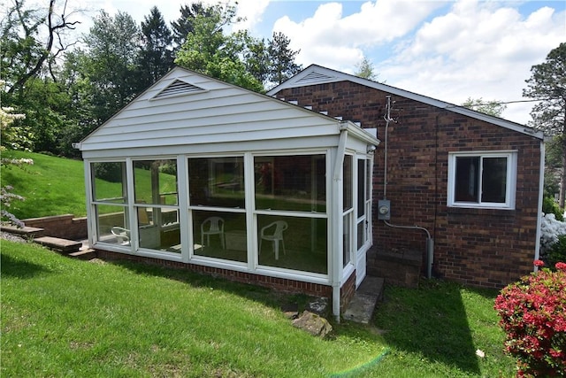 2113 Hillard Rd, Bethel Park, PA 15102 - back of property featuring a sunroom, brick siding, and a yard