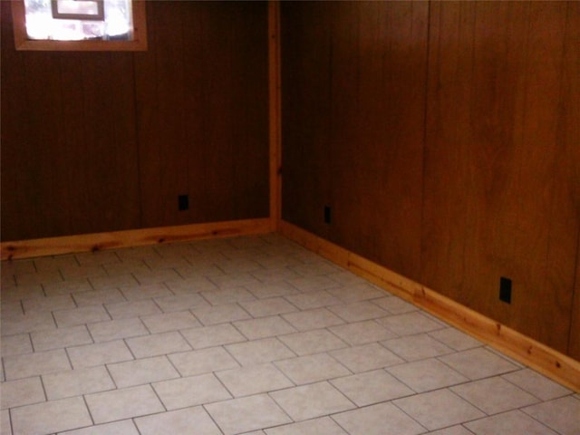 below grade area with wood walls and baseboards