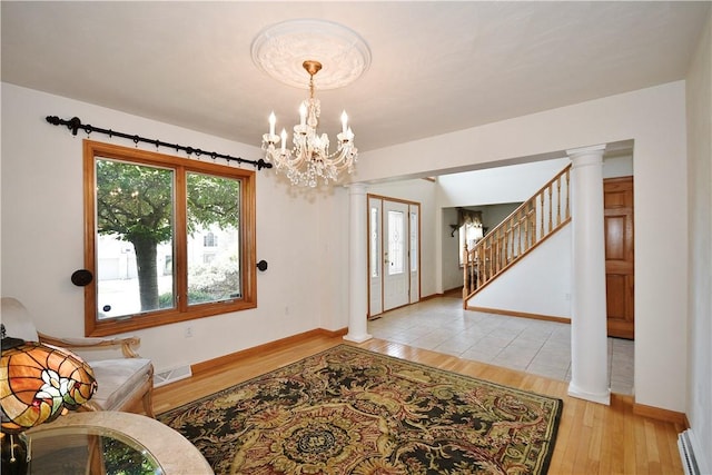 1004 Cicero Dr, Hempfield Twp Wml, PA 15642 - entrance foyer with light wood-style flooring, a chandelier, baseboards, and stairway