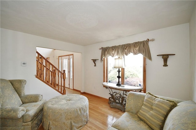1004 Cicero Dr, Hempfield Twp Wml, PA 15642 - living room with plenty of natural light, stairway, light wood-type flooring, and baseboards