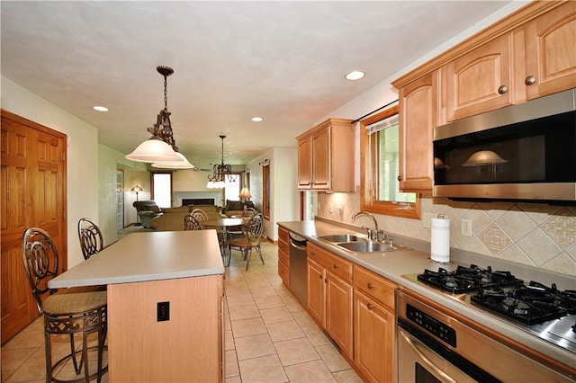 1004 Cicero Dr, Hempfield Twp Wml, PA 15642 - kitchen with appliances with stainless steel finishes, a sink, light tile patterned floors, open floor plan, and recessed lighting