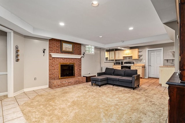 106 Briar Hill Dr, Jackson Twp But, PA 16063 - living area with light tile patterned floors, recessed lighting, a tray ceiling, a brick fireplace, and baseboards