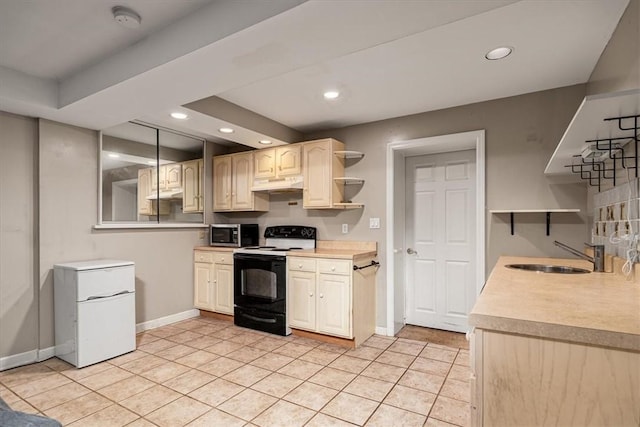 106 Briar Hill Dr, Jackson Twp But, PA 16063 - kitchen with range with electric stovetop, a sink, stainless steel microwave, under cabinet range hood, and refrigerator