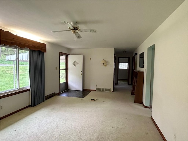 90 Dague Ln, South Franklin, PA 15301 - unfurnished living room featuring plenty of natural light, light carpet, and baseboards