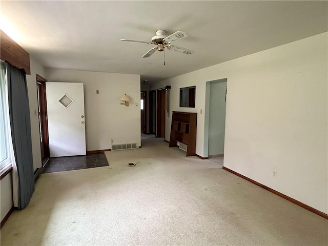 90 Dague Ln, South Franklin, PA 15301 - unfurnished living room with carpet, a ceiling fan, and baseboards