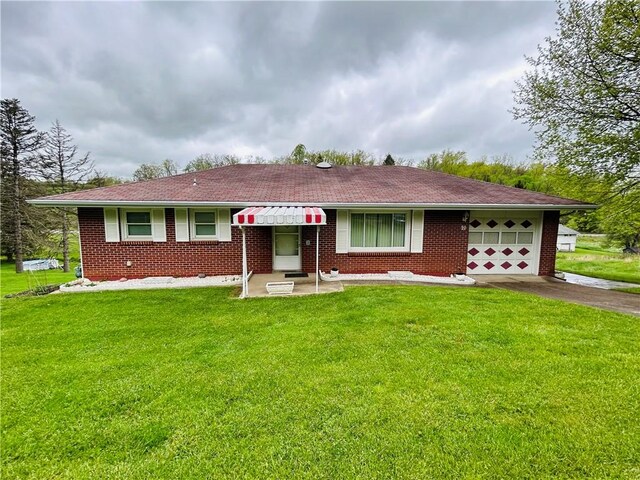 90 Dague Ln, South Franklin, PA 15301 - single story home with an attached garage, driveway, a front yard, and brick siding