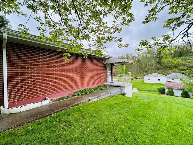 90 Dague Ln, South Franklin, PA 15301 - view of side of property featuring a yard and brick siding