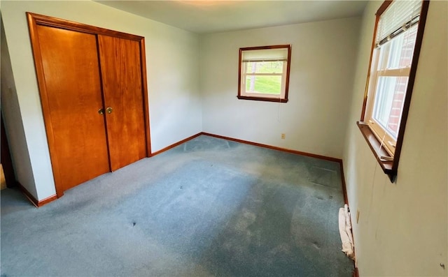 90 Dague Ln, South Franklin, PA 15301 - unfurnished bedroom featuring carpet floors, baseboards, a closet, and a baseboard heating unit