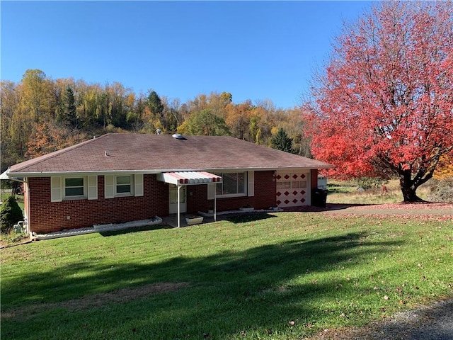 90 Dague Ln, South Franklin, PA 15301 - ranch-style home featuring a garage, a front lawn, and brick siding