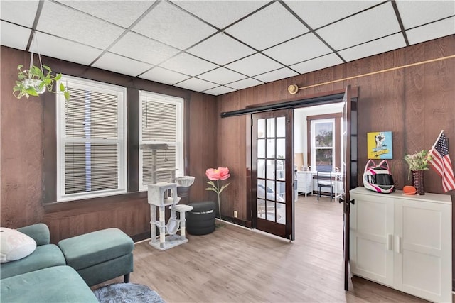 2832 Clermont Ave, Brentwood, PA 15227 - sitting room with a paneled ceiling, wooden walls, and wood finished floors